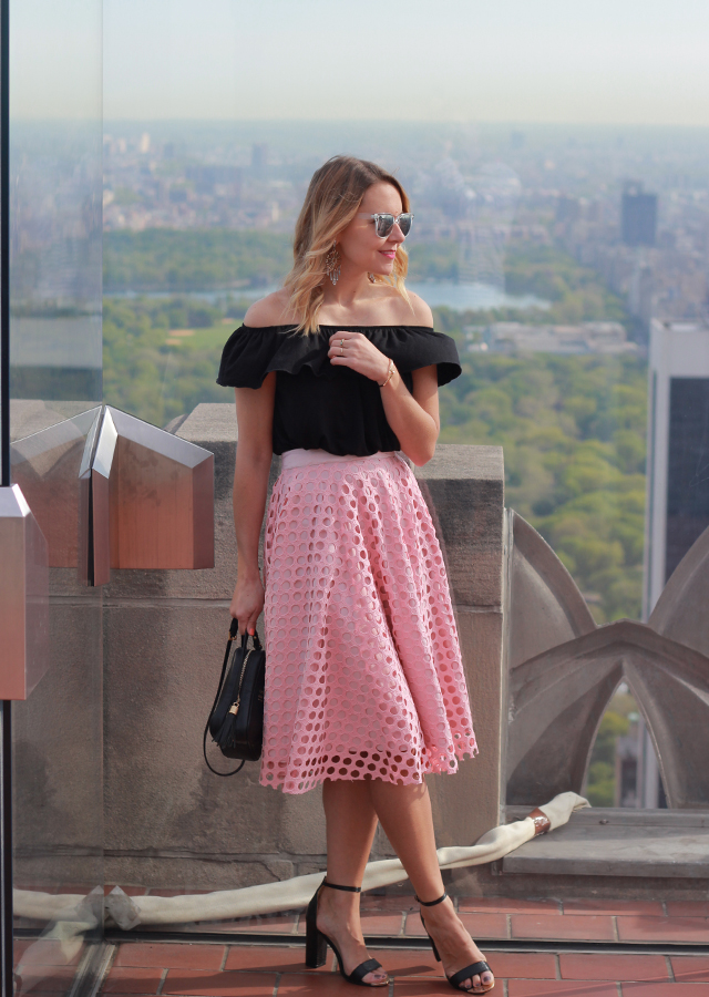 Top of the Rock NYC in pink midi skirt and off the shoulder top