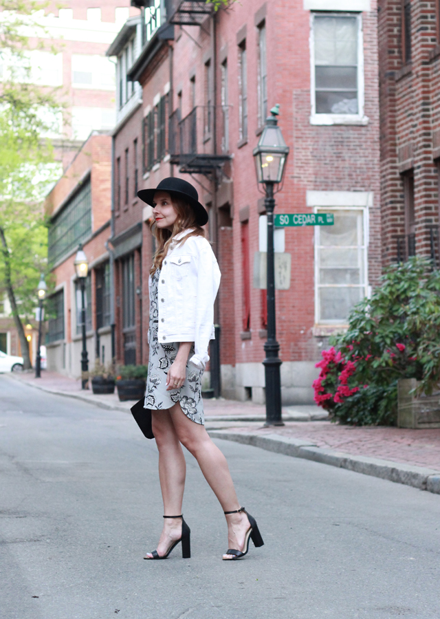 The Steele Maiden: Night out style in printed shift dress, white denim jacket, wide brim hat and ankle strap heels