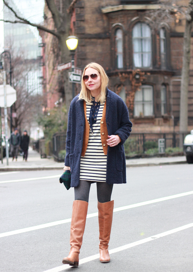 Striped lace-up dress, navy cocoon coat, and OTK riding boots
