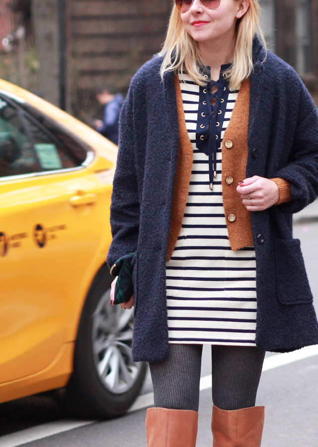 Striped lace-up dress, navy cocoon coat, and OTK riding boots